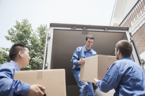 Professional man and van helping with household move in Emersonpark