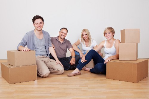 Moving team handling furniture during a home relocation in Emersonpark